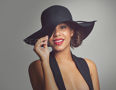 Buy stock photo Fashion, portrait and elegant woman in hat, studio and smile isolated on gray background. Face, confident and style for summer outfit, classy aesthetic and clothes with glamour cosmetics in Brazil