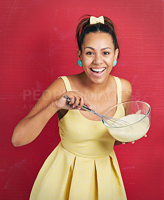 Buy stock photo Woman, portrait and baking or bowl in studio as housewife in dress for dessert snack, cooking or whisk. Female person, face and red background with mockup space for sweets candy, happiness or mock up