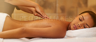 Buy stock photo Cropped shot of a young woman getting a massage at the spa