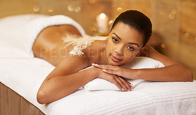 Buy stock photo Happy woman, portrait and relax with salt scrub at spa for back massage, skincare or beauty treatment. Calm female person lying on bed for therapy, zen or exfoliation at luxury hotel, resort or salon
