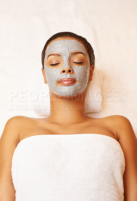 Buy stock photo Woman, relax and face mask at spa above in beauty, skincare or anti aging on massage bed. Top view of calm or young female person in relaxation for facial treatment, exfoliation or cosmetics at salon
