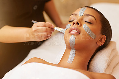 Buy stock photo Woman, relax and face mask with brush at salon for beauty, skincare or anti aging on massage bed. Calm female person or sleeping with beautician in relaxation for facial treatment or cosmetics at spa