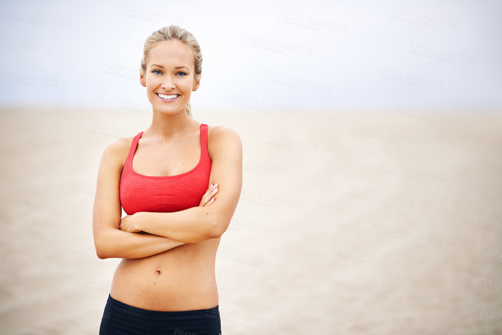 Buy stock photo Woman, portrait and fitness on beach sand with arms crossed, confident and smile with wellness and outdoor. Exercise, athlete and sports with happiness for health, marathon or race for cardio workout