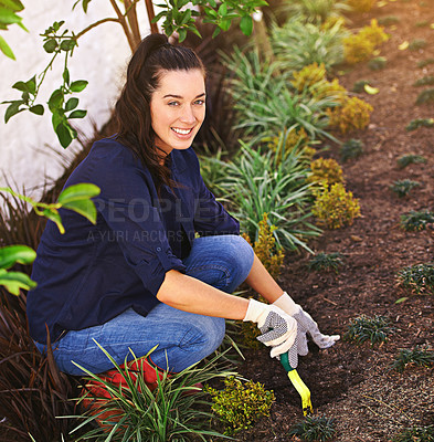 Buy stock photo Portrait of a young woman working in her garden