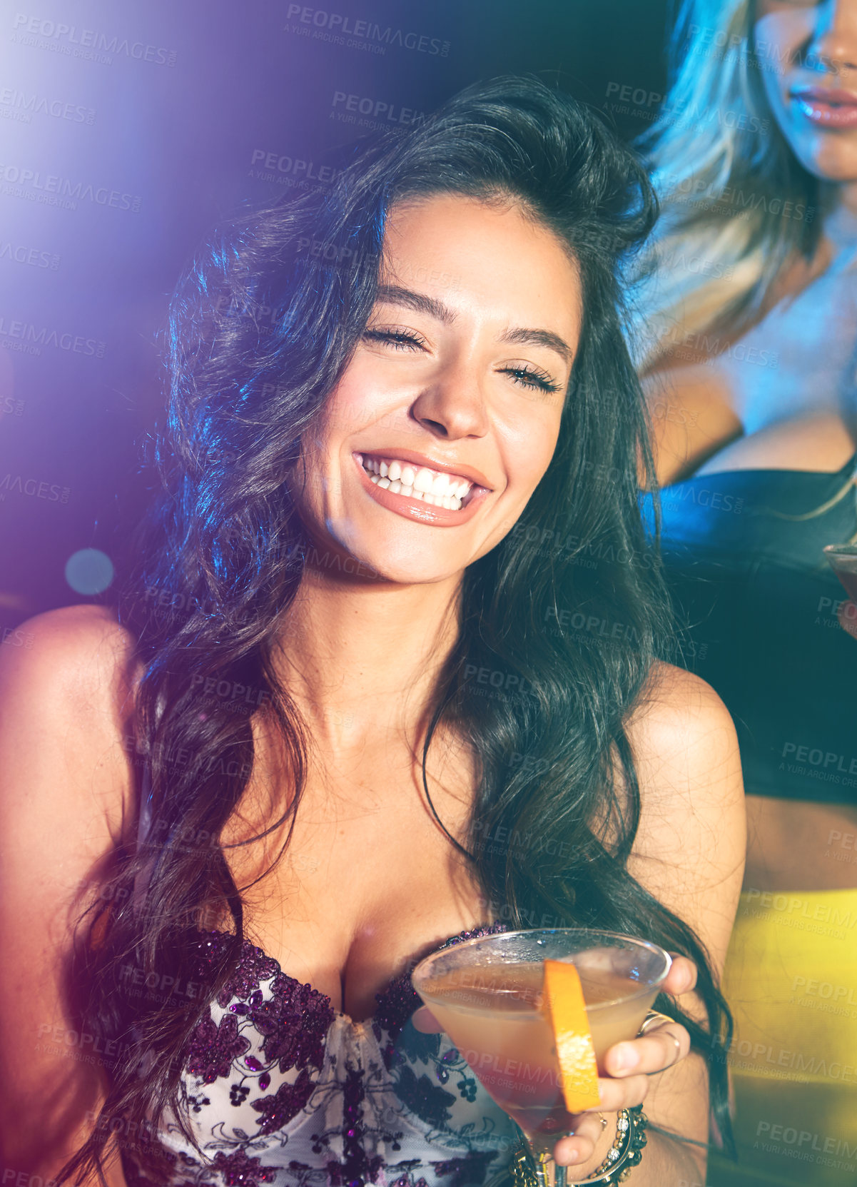 Buy stock photo Shot of young women partying in a nightclub