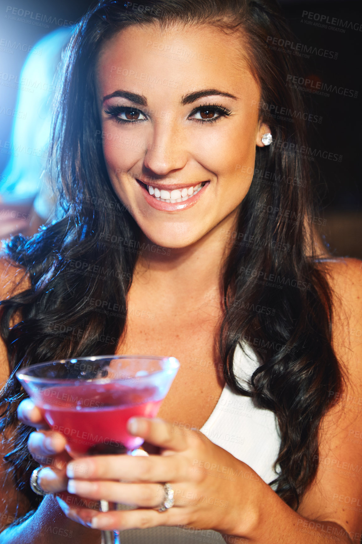 Buy stock photo Shot of a young woman partying in a nightclub