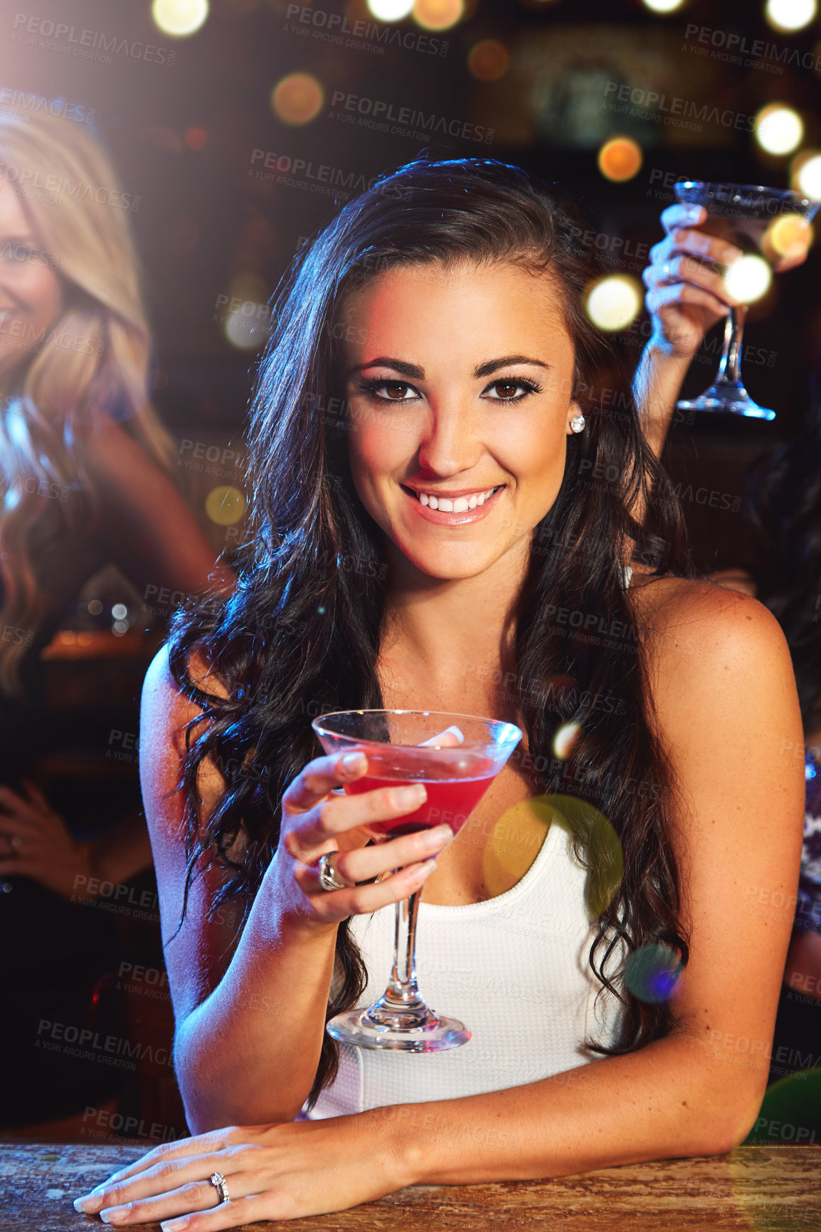 Buy stock photo Shot of a young woman partying in a nightclub