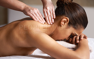 Buy stock photo Cropped shot of a young woman getting a neck massage at a spa