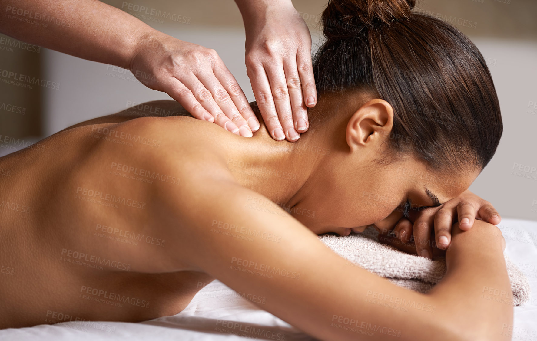 Buy stock photo Cropped shot of a young woman getting a neck massage at a spa