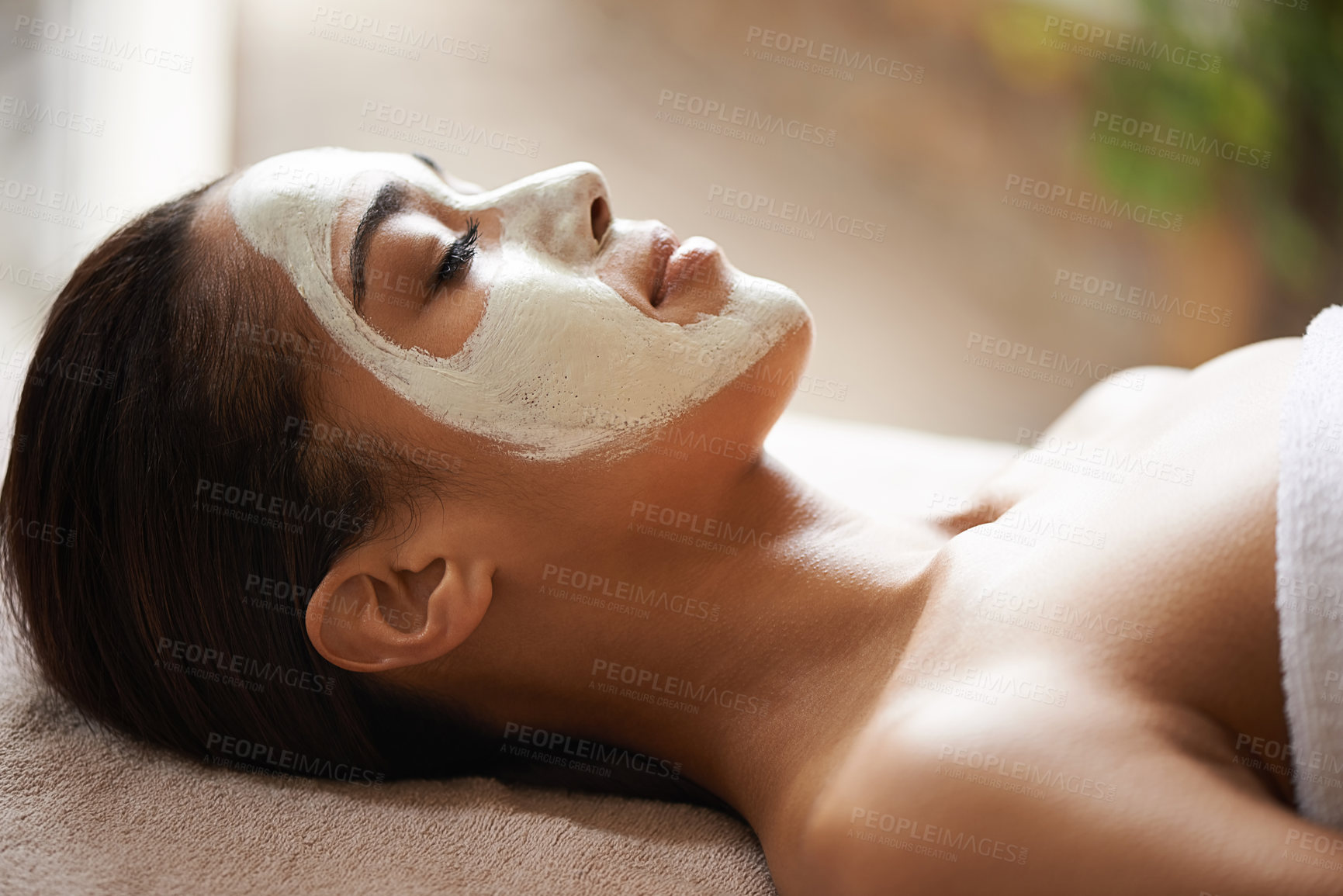 Buy stock photo Skincare, wellness and woman with face mask at spa for glow, natural and beauty routine with peace. Cosmetic, pamper and female person relaxing for clay facial dermatology treatment at salon.
