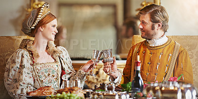 Buy stock photo Royal, man and woman with luxury in palace, wine and toast  for wealth by wedding and regal. King and queen with smile for food with alcohol to drink together, happiness and rich in marriage