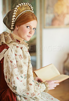 Buy stock photo Portrait of an elegant noble woman reading in her palace room