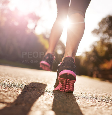 Buy stock photo Cropped shot of a woman's legs out for a run