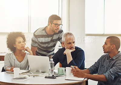 Buy stock photo Shot of a group of coworkers having a meeting in an office