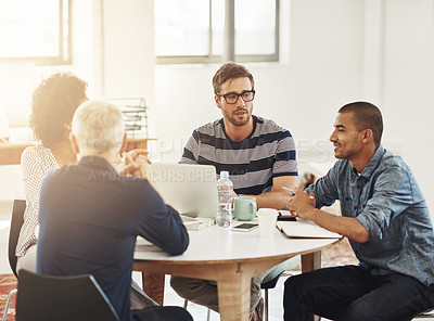 Buy stock photo Shot of a group of coworkers having a meeting in an office