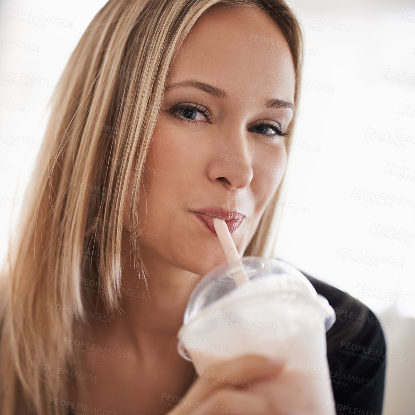 Buy stock photo Portrait, happy woman and drinking a milkshake in home,  wellness and smoothie for break on weekend. Face, positive and healthy person with fruit cocktail on sofa, nutrition and vitamins in apartment