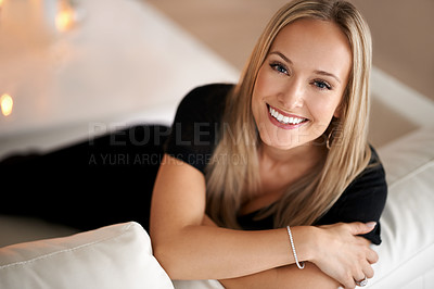 Buy stock photo Portrait, happy woman and relax on couch in home, wellness and peace with candles for zen. Face, positive and blonde lady with wax light on sofa, mindfulness and tranquility on weekend in living room