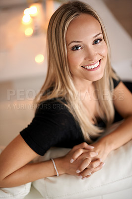 Buy stock photo Portrait, woman and smile on couch in living room, wellness and candles for peace in apartment. Face, positive and blonde lady to relax on sofa, mindfulness and tranquility on weekend night in home