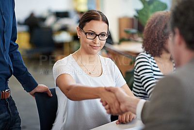 Buy stock photo Happy, female person and meeting with handshake in office for creative startup, teamwork and feedback for staff. Man, partner and greeting employee in professional workplace for review with report 