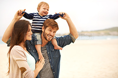 Buy stock photo Love and baby with parents at a beach for piggyback, fun and walking in nature. Family, kid and happy woman with man outdoors bonding, smile and relax while enjoying travel, freedom or game