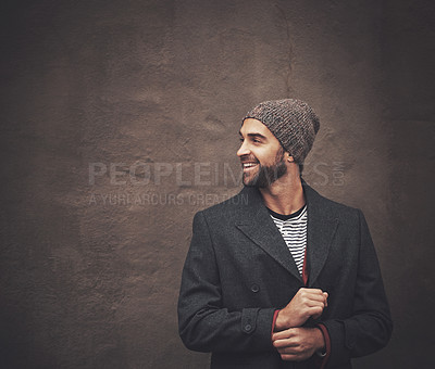 Buy stock photo Man, smile and thinking with fashion in winter for happiness, warm clothes and cool style by brown wall. Male person, pride and joy with confidence for trendy outfit, good mood and positivity