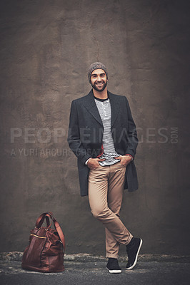Buy stock photo Man, portrait and smile with downtown, fashion and trendy gentleman jacket. Model, winter and beanie for city, happiness or outdoor positivity for cool hipster style isolated on brown wall background