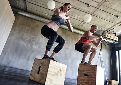 Buy stock photo Gym, fitness and friends with jump box for training, workout and intense cardio on wall background. Jumping, exercise and people at a sports center for wellness, performance and endurance challenge