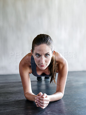 Buy stock photo Gym floor, portrait and woman focus on plank exercise, health motivation or core muscle building. Balance challenge, hard work mindset and person doing body development workout in fitness studio