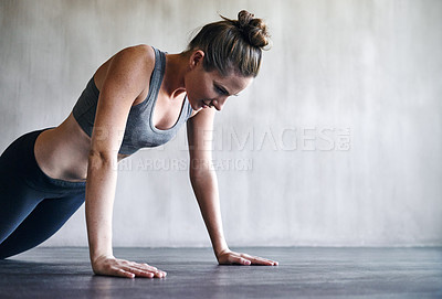 Buy stock photo Workout, gym and woman doing floor push up for exercise, health commitment and training for muscle building growth. Fitness mockup, healthy lifestyle and female athlete focus on health performance
