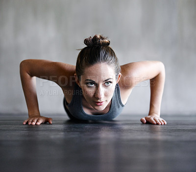 Buy stock photo Pushup, fitness and woman on a floor for training, cardio and endurance at gym. Push up, exercise and female athlete at a health center for core, strength and ground workout with determined mindset