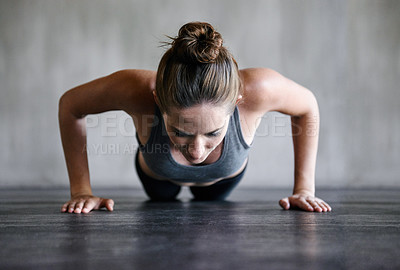 Buy stock photo Training, push up and woman on a floor for fitness, cardio and endurance at gym. Plank, exercise and female athlete at a health center for core, strength and ground workout with determined mindset