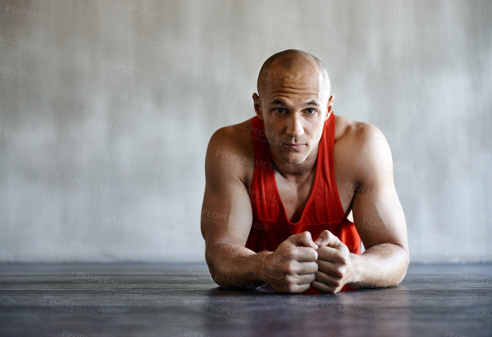 Buy stock photo Shot of a man doing a challenging workout at the gym