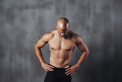 Buy stock photo A shirtless sportsman standing against a gray background
