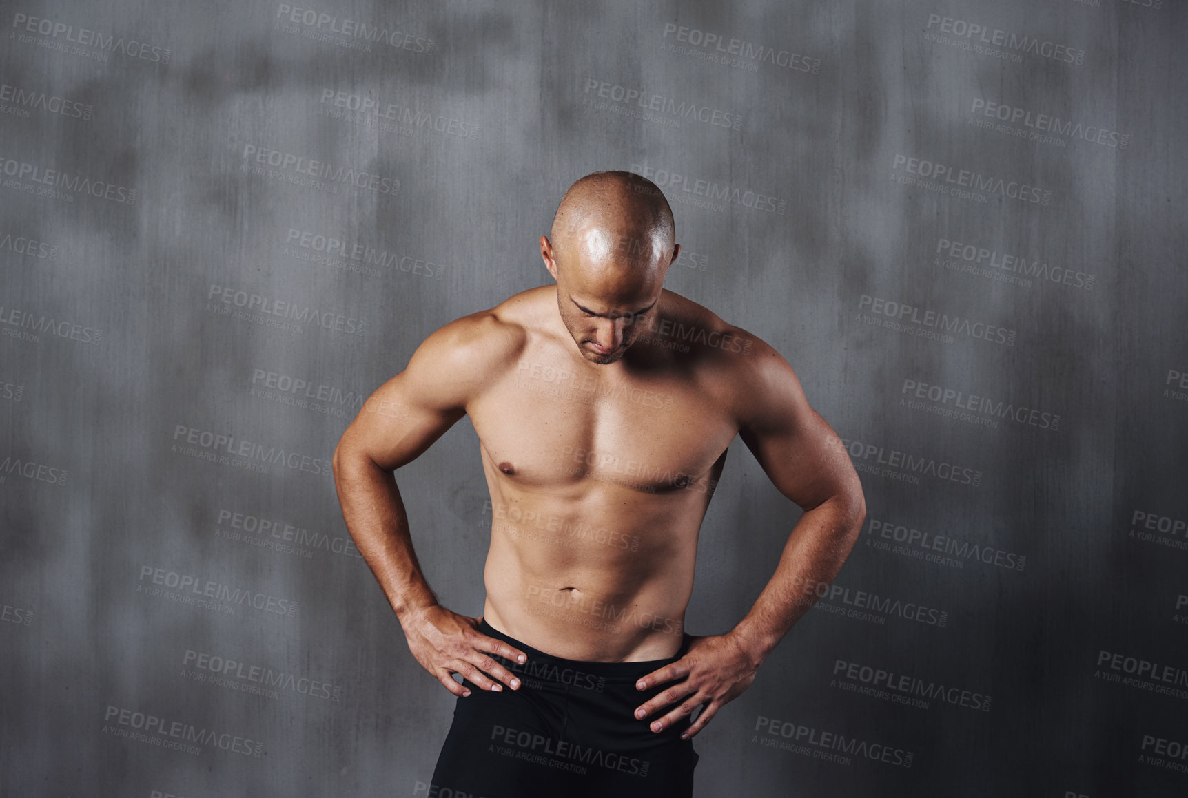 Buy stock photo A shirtless sportsman standing against a gray background