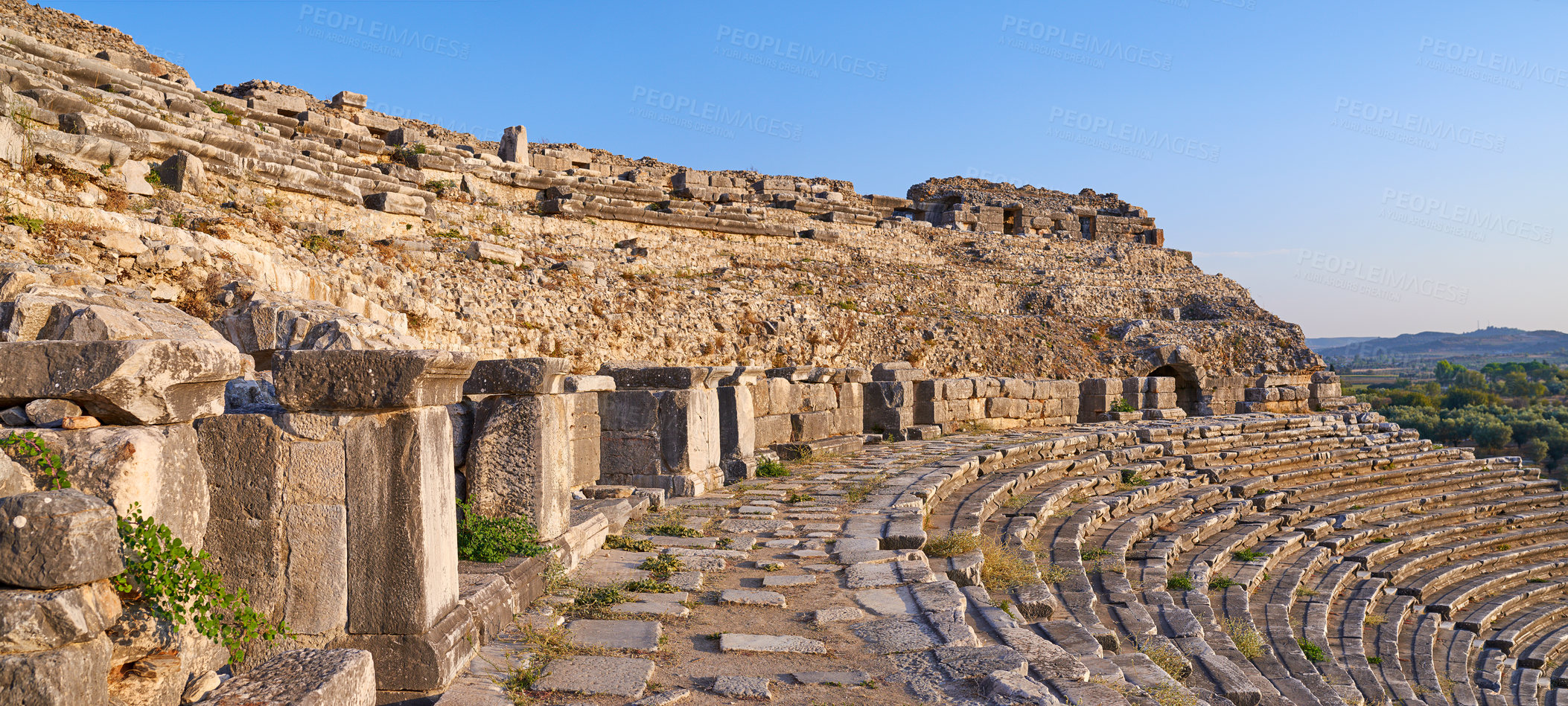 Buy stock photo Landscape, outdoor and ancient Greek architecture with stone, wall and city for tourism landmark. Building, ampihitheater or stadium in nature with culture, heritage and history in Bodrum, Turkey