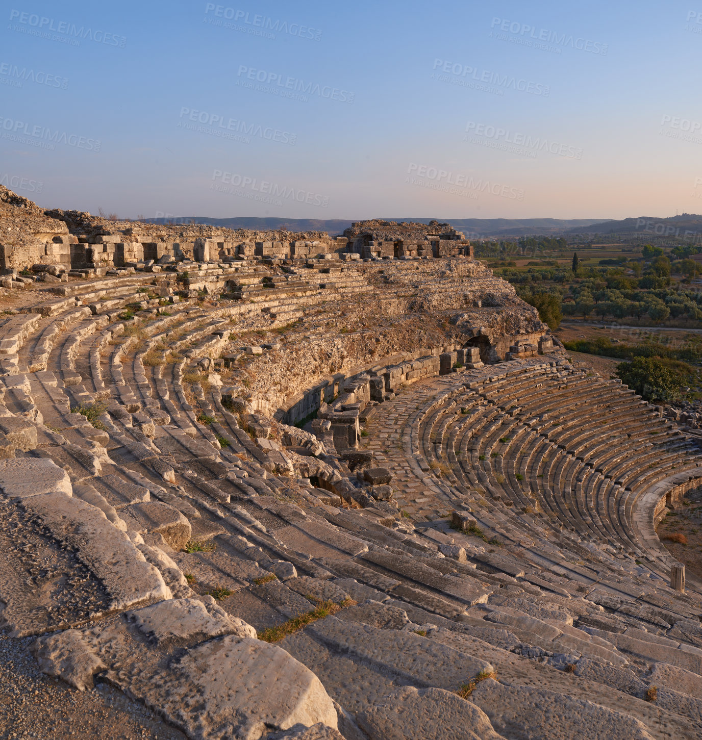 Buy stock photo Landscape, outdoor and ancient Greek ruins with stone, wall and architecture for tourism landmark. Building, ampihitheater or stadium in nature with culture, heritage and history in Bodrum, Turkey