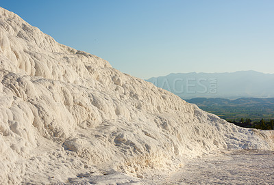 Buy stock photo Cotton castle area with carbonate mineral after flowing thermal spring water. Landscape of travertine pools and terraces in Pamukkale Turkey. Traveling abroad, overseas for holiday, vacation, tourism