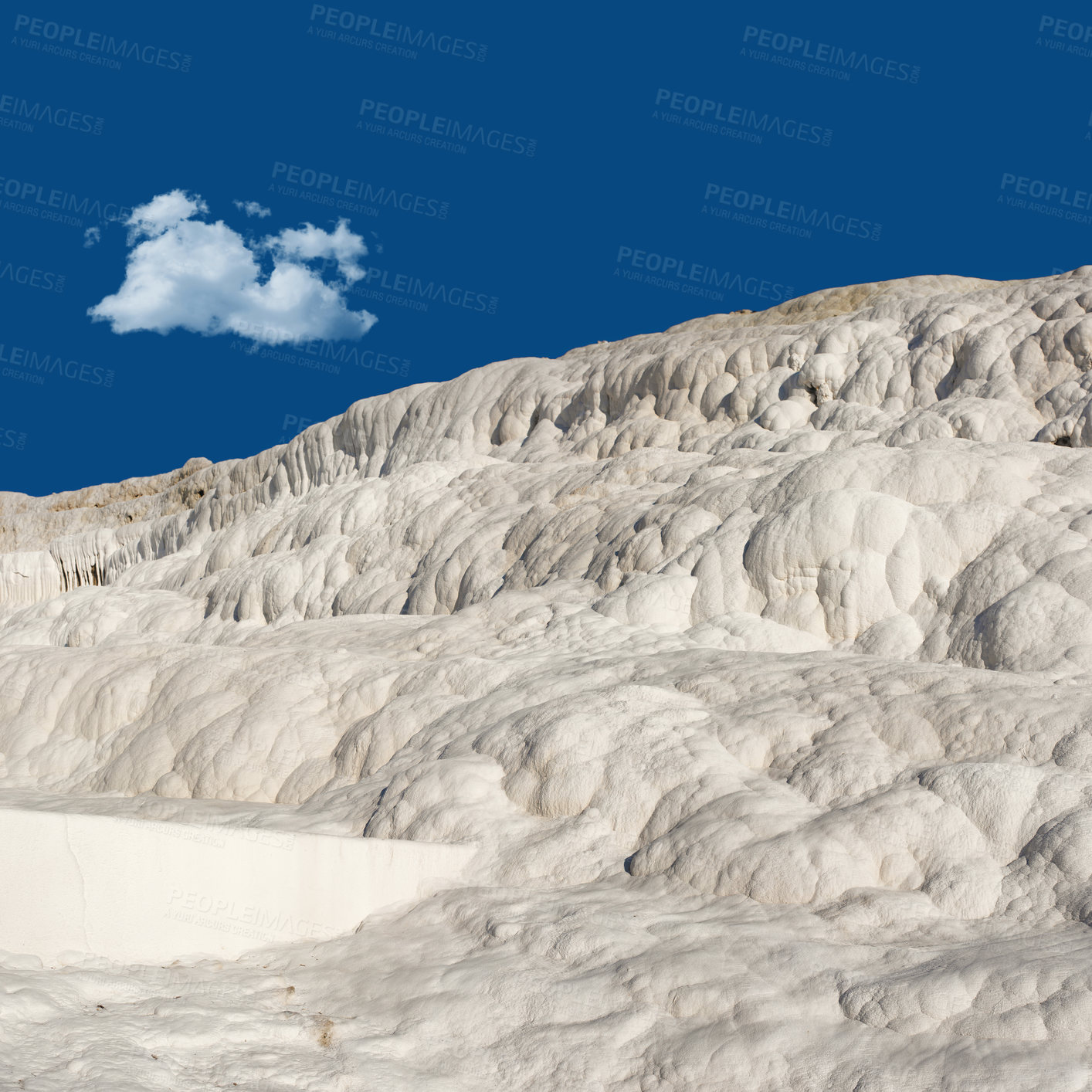 Buy stock photo Scenic view of the Travertine terraces in pamukkale, Turkey. Desert sand with curvy pattern texture against a blue sky. Tourism holiday destination at rock cotton castle location during hot springs