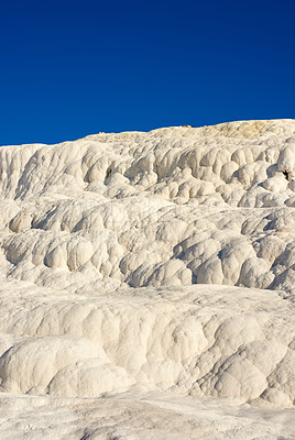 Buy stock photo The Travertine pools and terraces in Pamukkale, Turkey. Desert sand with curvy pattern texture against a blue sky. Tourism holiday destination at rock cotton castle location during hot springs