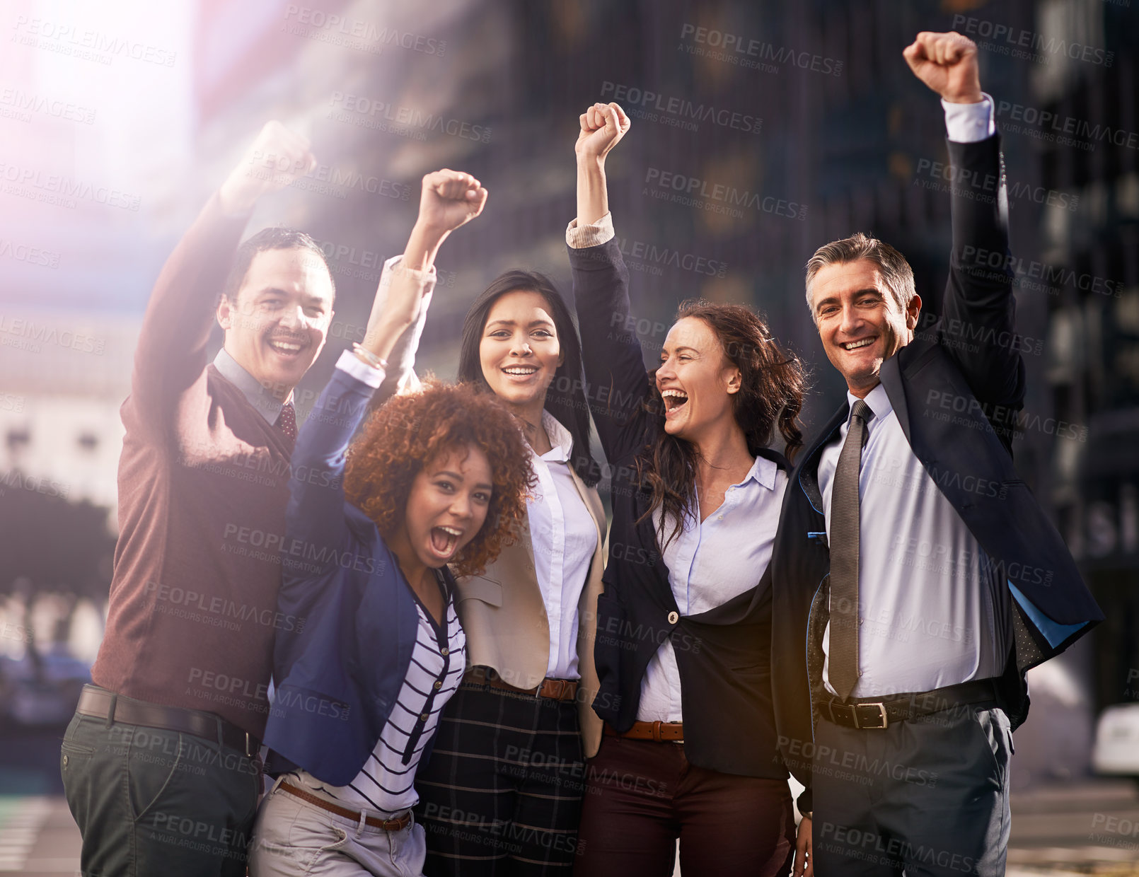 Buy stock photo Shot of a group of excited businesspeople in the city