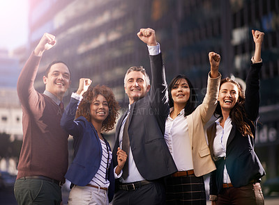 Buy stock photo Shot of a group of excited businesspeople in the city