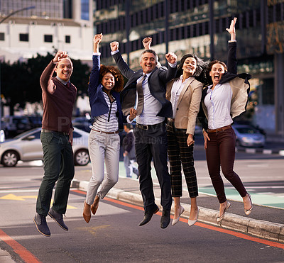 Buy stock photo A group of businesspeople jumping with excitement in the city