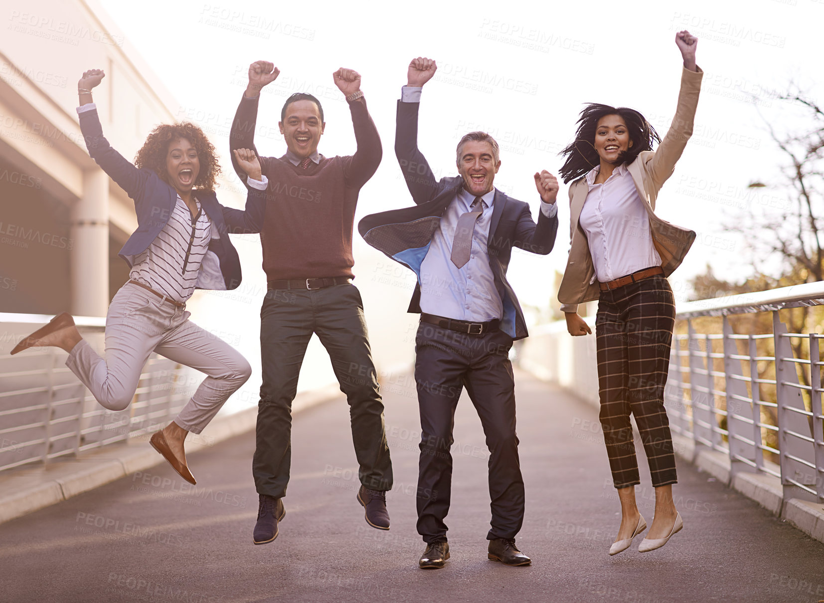 Buy stock photo A group of businesspeople jumping with excitement outside