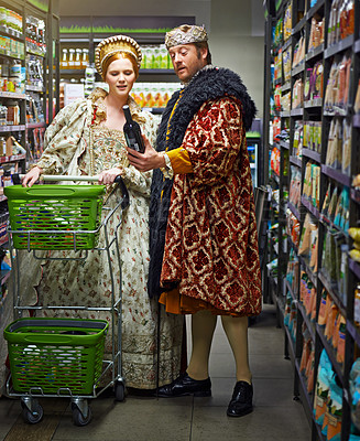 Buy stock photo Supermarket, king and queen with wine, choice and costume with increase prices and inflation. Royal couple, man and woman with selection and alcohol with decision and customers with expensive product