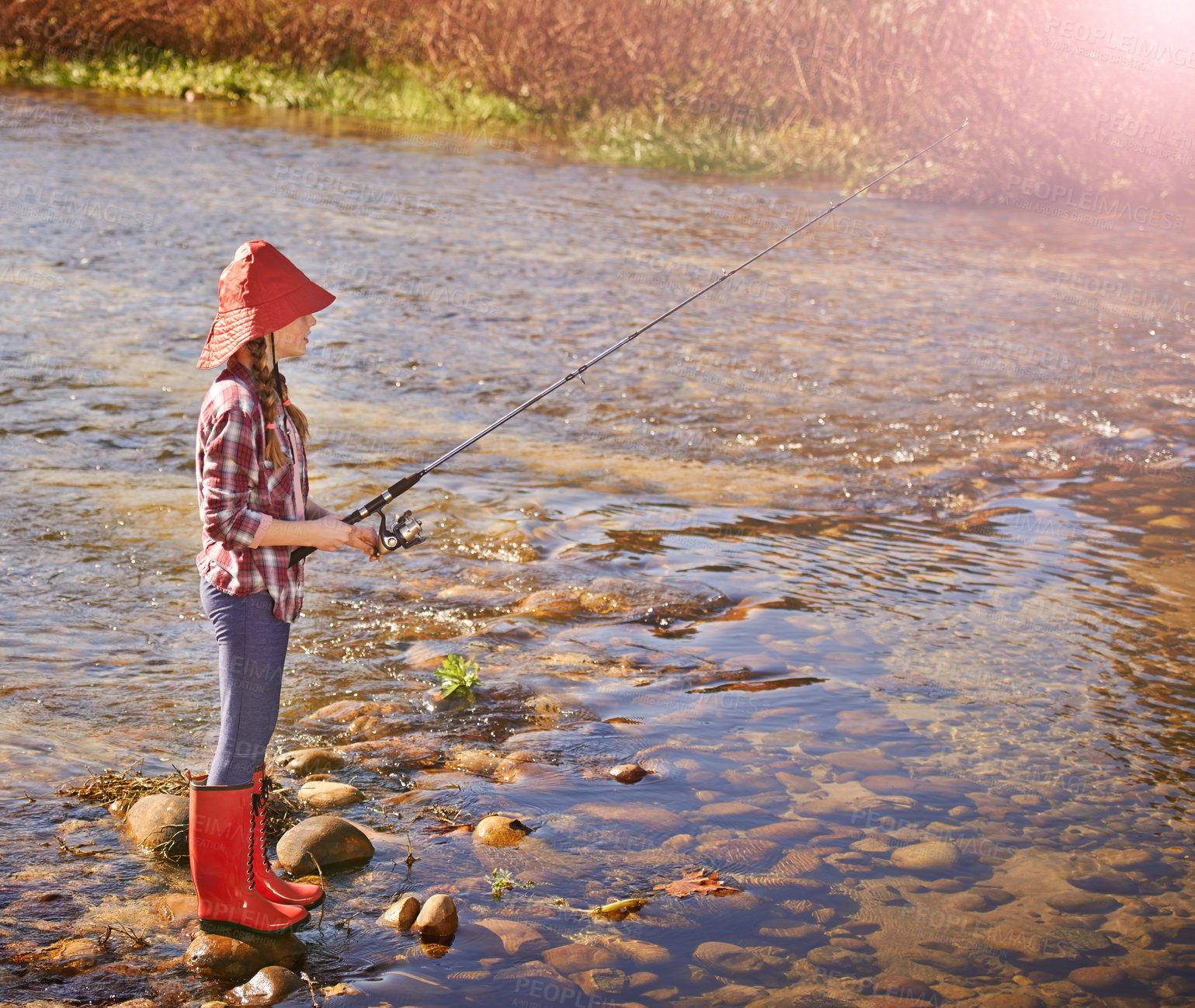 Buy stock photo Girl, kid and fishing at river in summer on holiday, vacation or travel outdoor in nature. Lake, fisher pole and child by water for adventure, flare and learning hobby for recreation at countryside