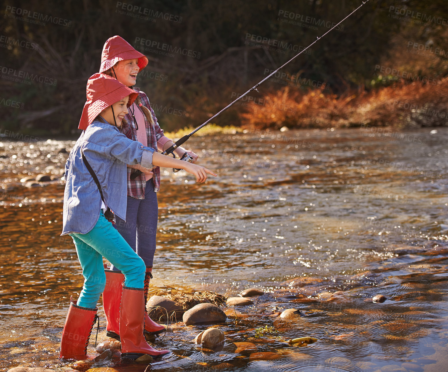 Buy stock photo Happy, travel and children fishing by river in nature on weekend trip, adventure or holiday. Smile, fun and girl kids with rod for catching sea animals in water for hobby or activity on vacation.