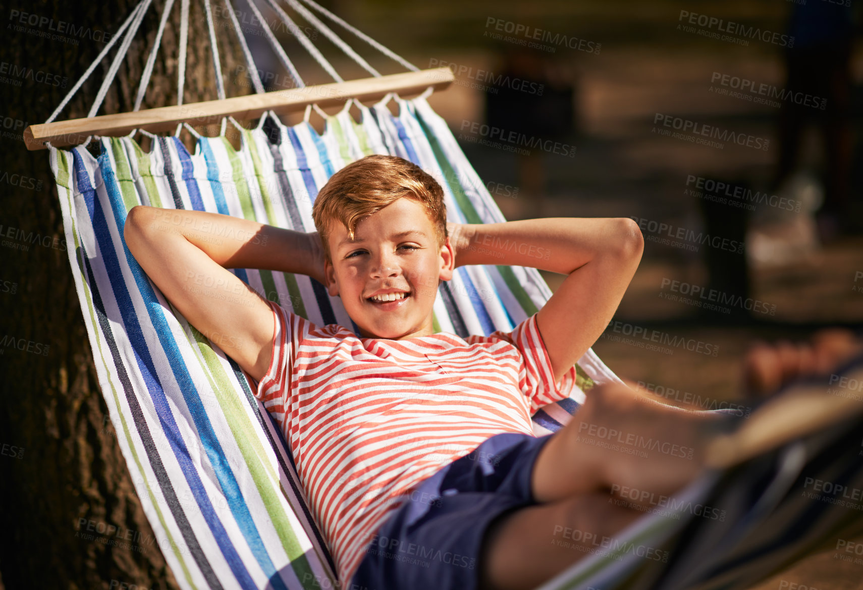 Buy stock photo Shot of a young boy relaxing in a hammock