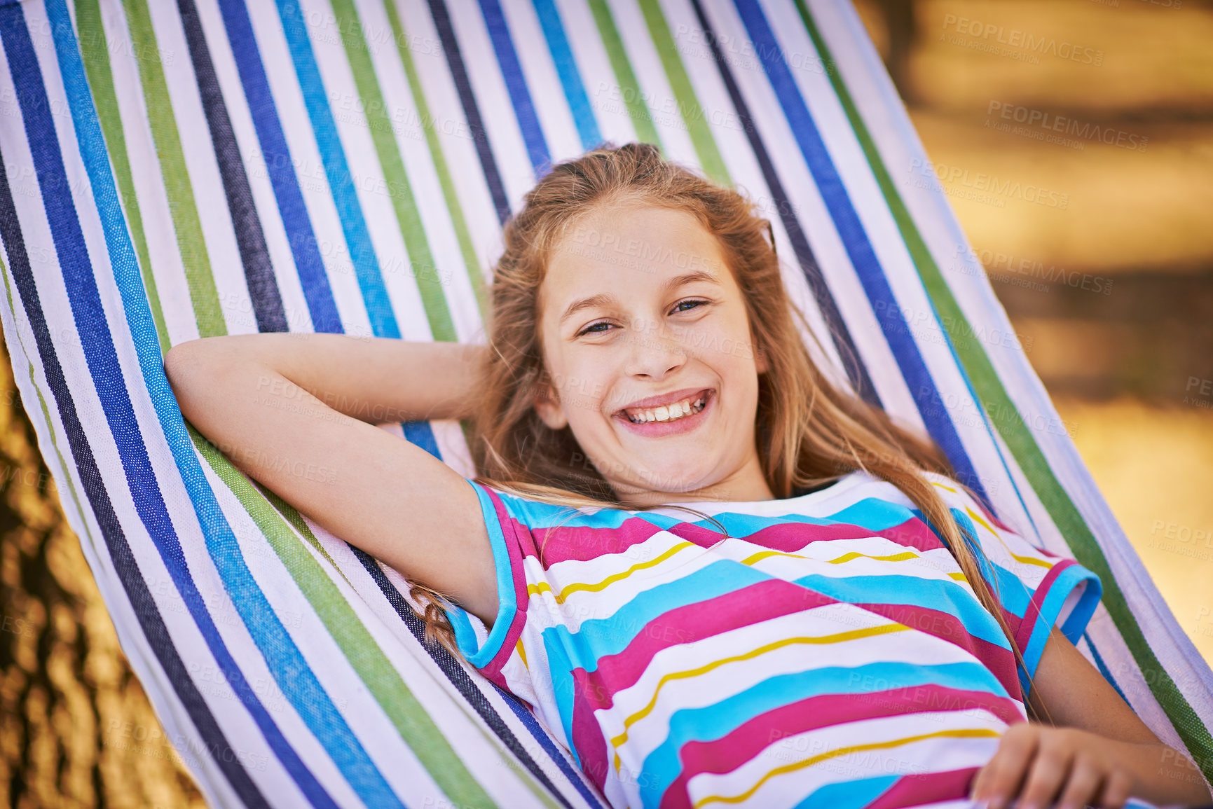 Buy stock photo Happy, hammock and portrait of girl, garden and relaxing excited with big smile, sunshine and adventure. Childhood, happiness and young child rest on vacation for break, summer and fun in nature