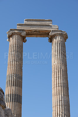 Buy stock photo Sky, vintage or sculpture of ancient pillars in city of Turkey for tourism, traditional infrastructure or culture in town. Architecture, history or structure design of relic for travel destination