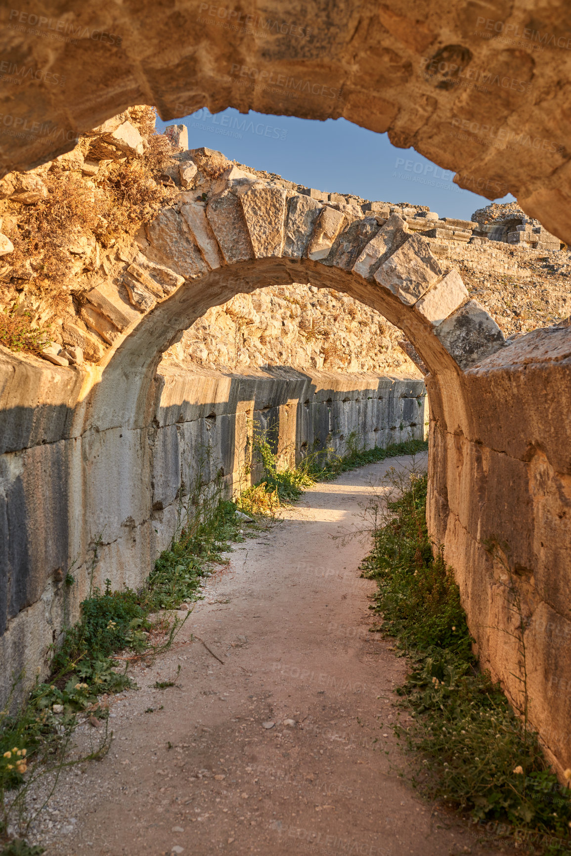 Buy stock photo Travel, culture and ancient architecture in Greece as temple, structure and old building at destination. Landmark, monument and tunnel with tourism, history and stone for discovery, adventure or path